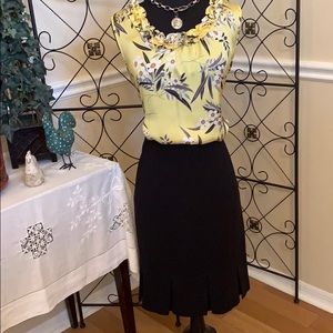 Black skirt ruffle hem.